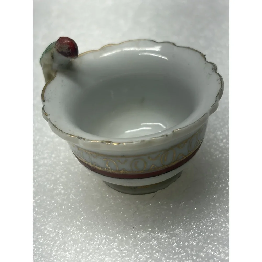 Vintage porcelain child's teacup with parrot bird handle Japan